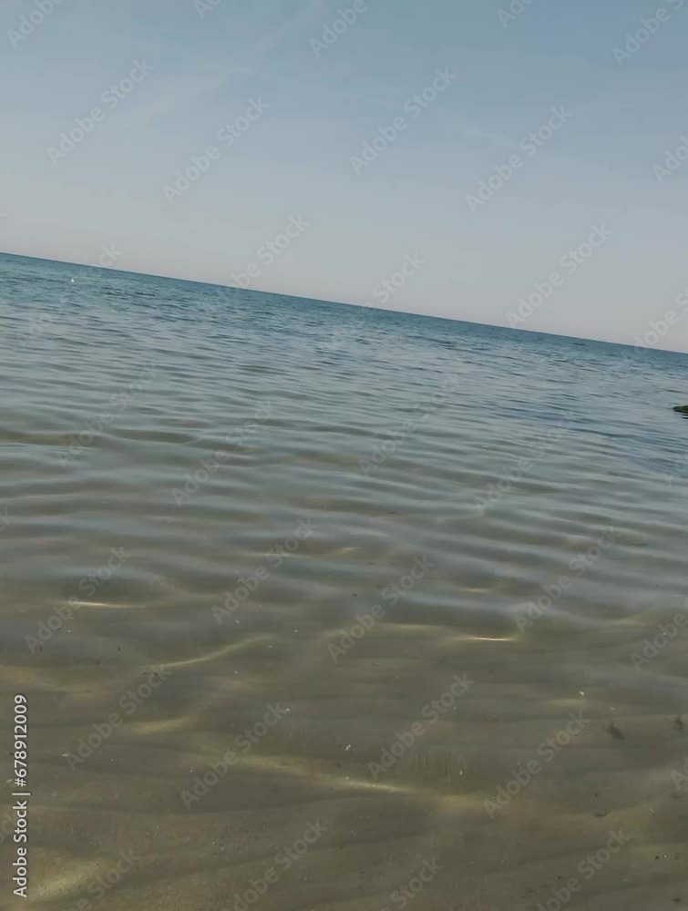 Drone shot at the beach, island and bridge during a sunny summer day