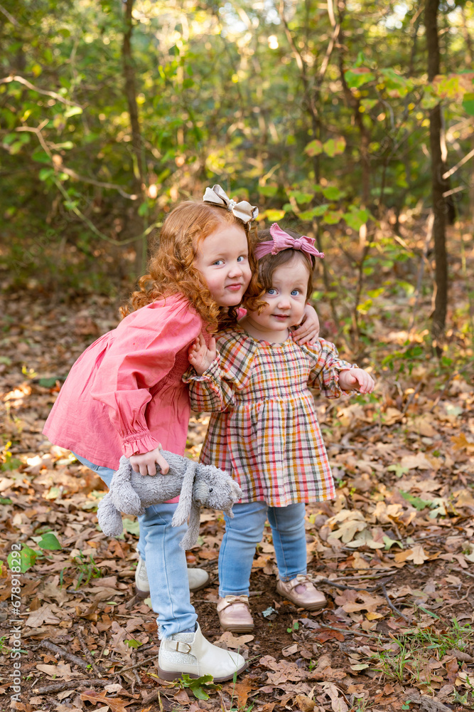 sisters hugging in the park sisters hugging in the park