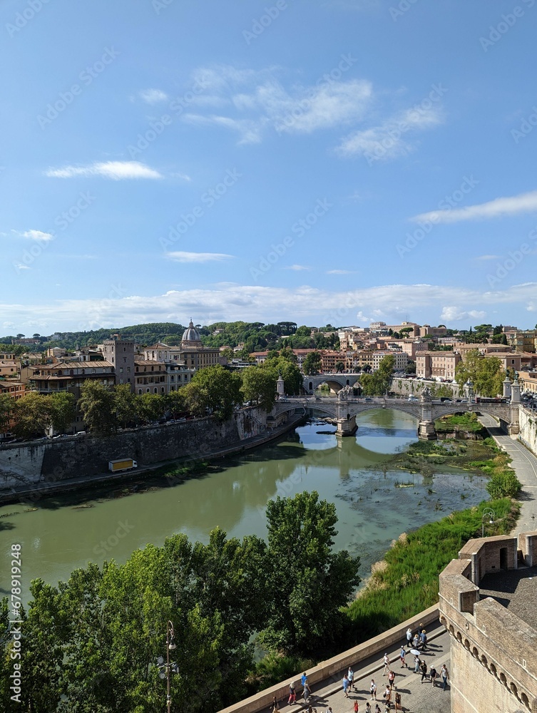Beautiful landscape of an old bridge over the river in ancient Rome, Italy