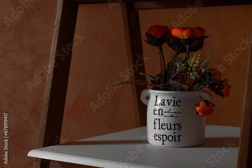 Εκτύπωση καμβά Delicate bouquet of flowers in the pot with La vie en fleurs espoir on it