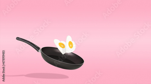 Creative idea with a frying pan and a two fried eggs in heart shape on a bright pink background. Minimal food and love concept. Breakfast idea for Valentine's day and romantic morning. Copy space.