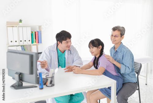 asian doctor diagnosis and explaning to child patient about disease symptoms, treatment process in hospital