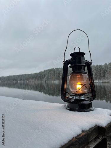  kerosene lamp, and near a winter lake © Yar