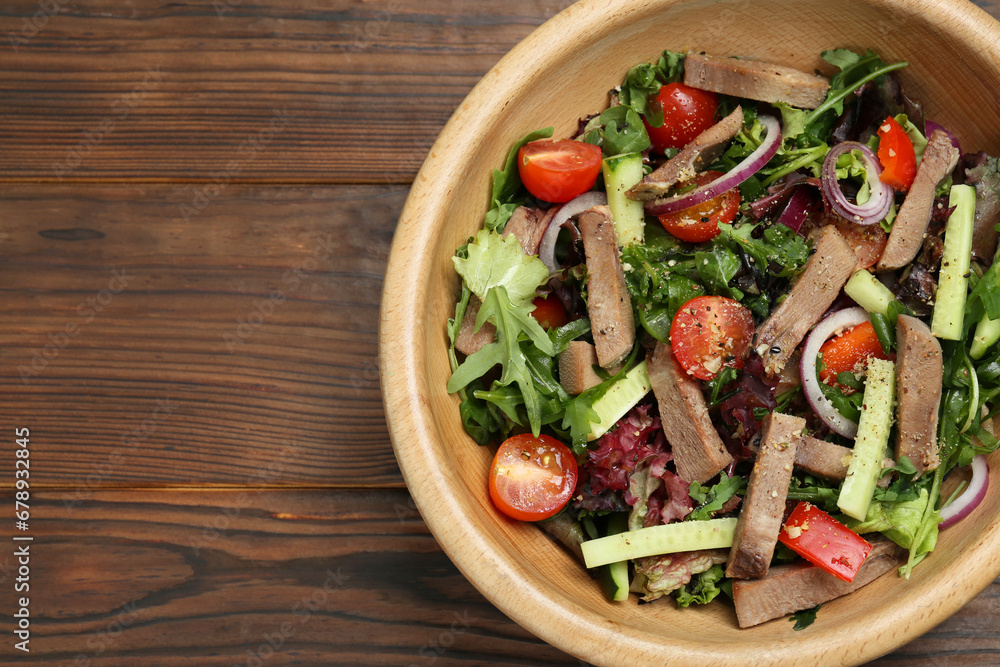 Delicious salad with beef tongue and vegetables on wooden table, top view. Space for text Delicious salad with beef tongue and vegetables on wooden table, top view. Space for text