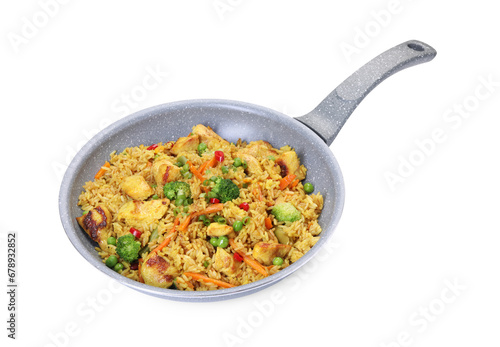 Tasty rice with meat and vegetables in frying pan isolated on white