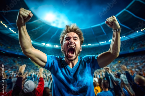 Enthusiastic male sports fan is fully immersed in the excitement of a soccer match with a high-energy crowd in background, her impassioned cheering shows the joy of sport