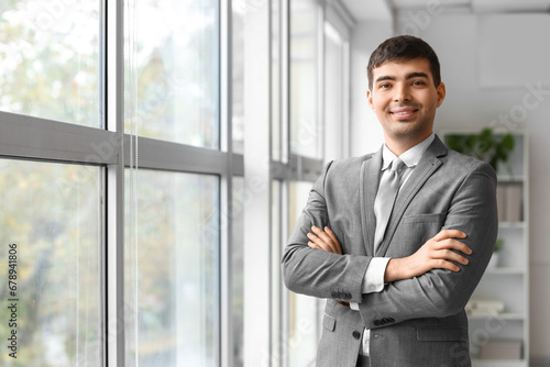 Young businessman smiling i...