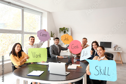 Business colleagues holding...