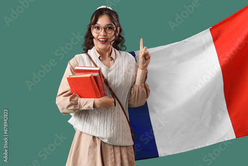 Young Asian woman with book...