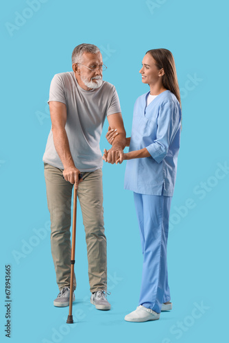 Young female caregiver assi...