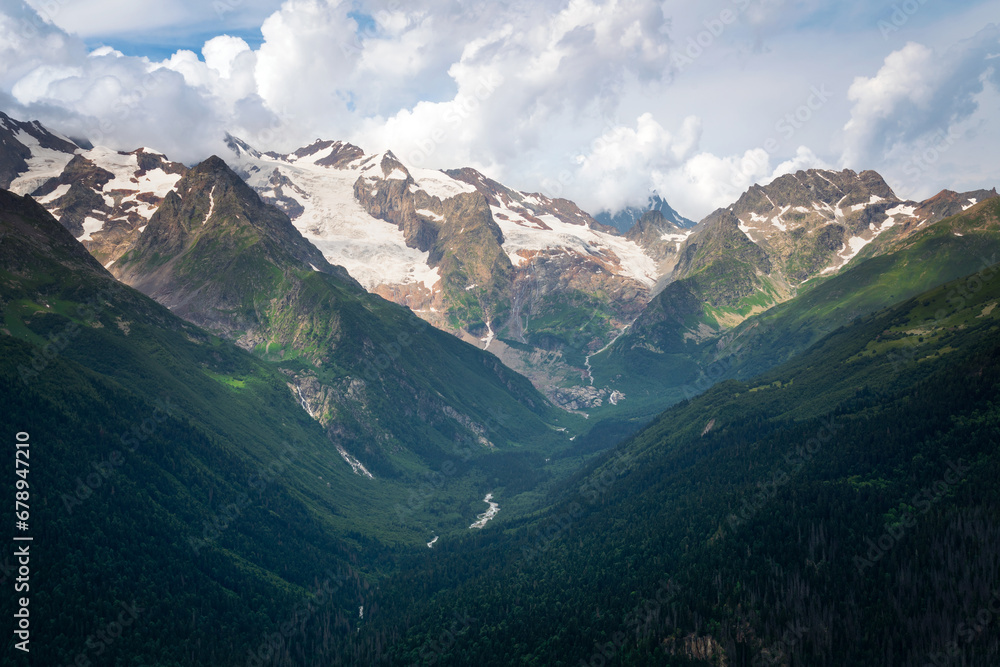 View of the Alibek Gorge, the Alibek River and the mountains of the Main Caucasian Ridge, opening from the upper station of the cable car system of the Dombay ski resort, Karachay-Cherkessia, Russia