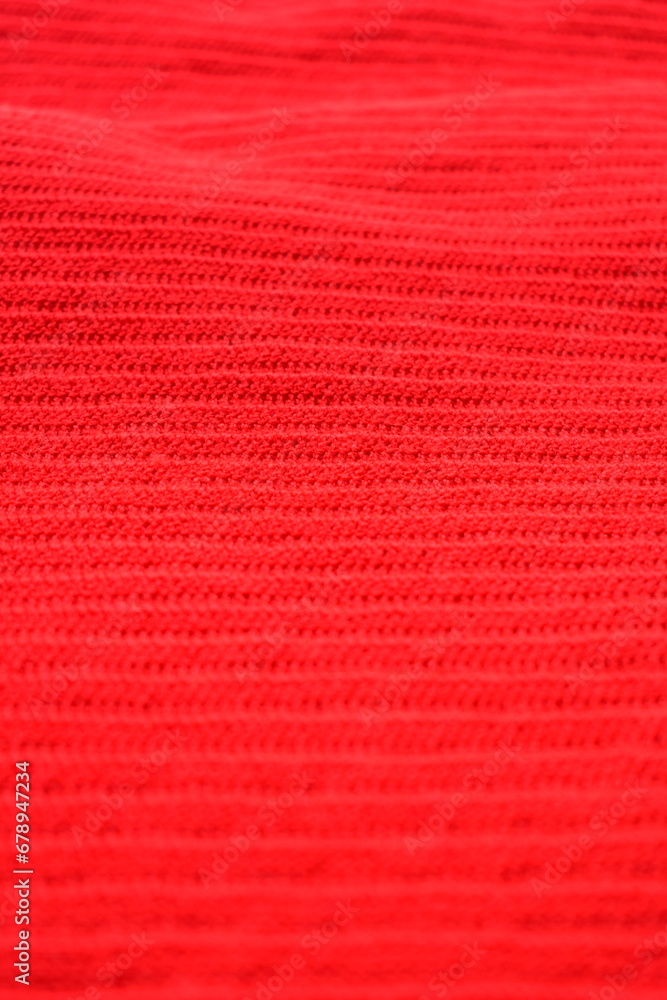 Fototapeta premium texture of red wool knitted yarn, woolen fabric background