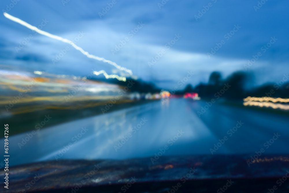 light of car on road in the night, blurred traffic jam background with rain light of car on road in the night, blurred traffic jam background with rain