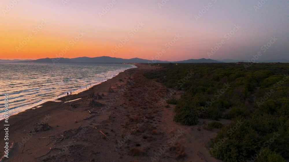 Maremma National Park in Tuscany, Italy. 4K UHD aerial drone footage of beach seaside coast at sunset. Maremma National Park in Tuscany, Italy. 4K UHD aerial drone footage of beach seaside coast at sunset.