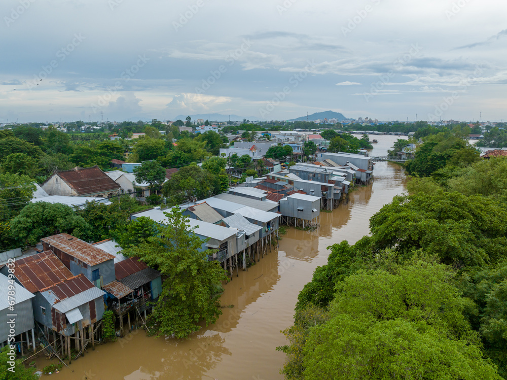 Rural scene with floating houses during flood season in Mekong Delta in Southern Vietnam