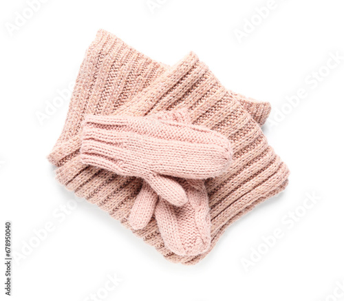 Pair of knitted mittens with warm scarf on white background