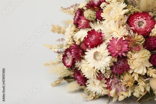 Beautiful bouquet of dry flowers on white background, closeup. Space for text