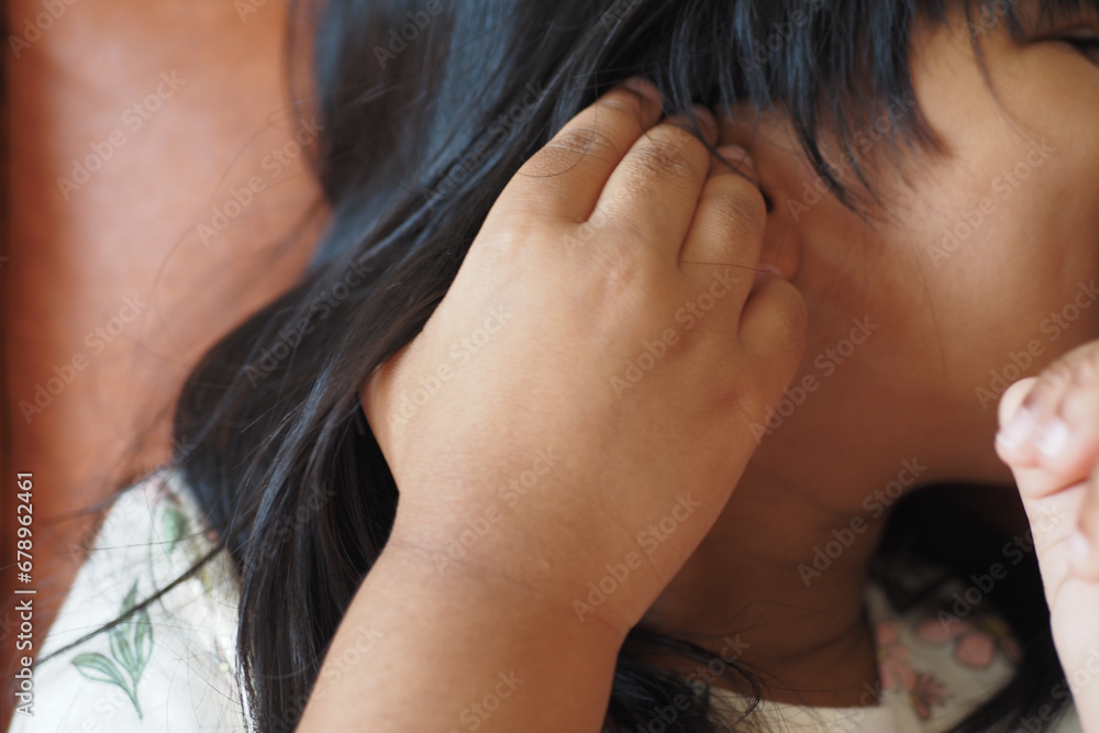child girl having ear pain touching his painful ear , child girl having ear pain touching his painful ear ,
