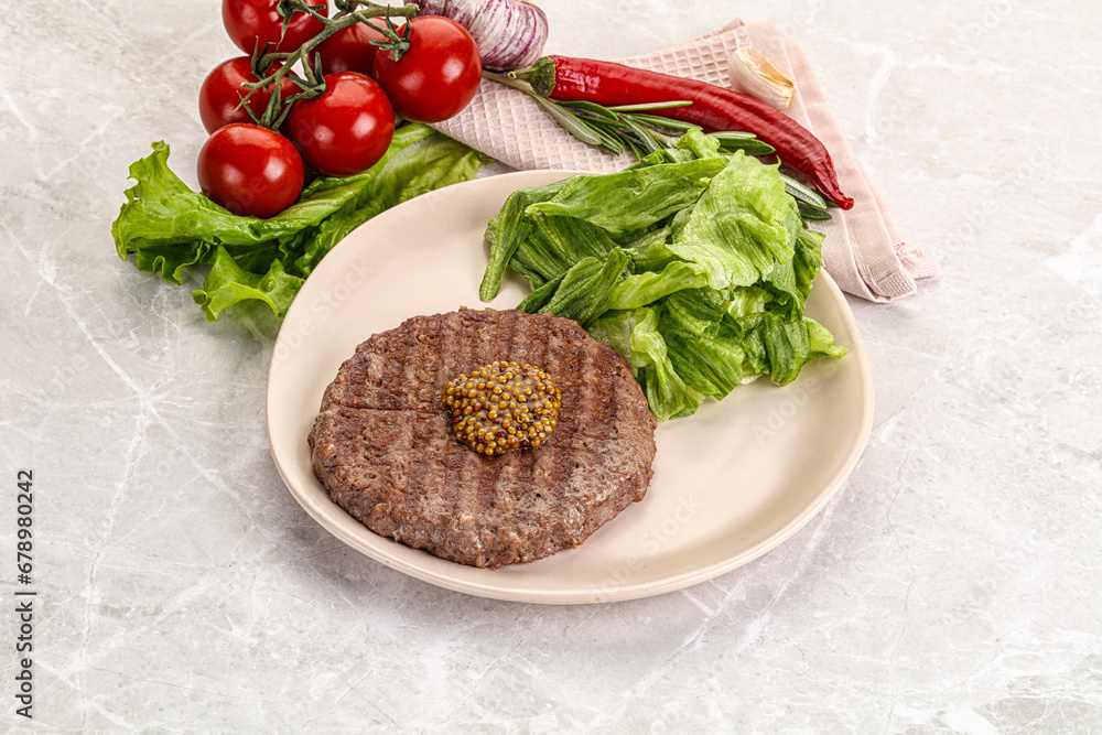 Frilled beef burger cutlet with iceberg Frilled beef burger cutlet with iceberg