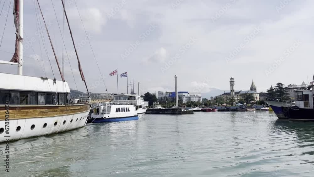 Batumi, Georgia - 05.19.2023 : Various boats and yachts along the coastline in the Black Sea. Batumi, Georgia - 05.19.2023 : Various boats and yachts along the coastline in the Black Sea.