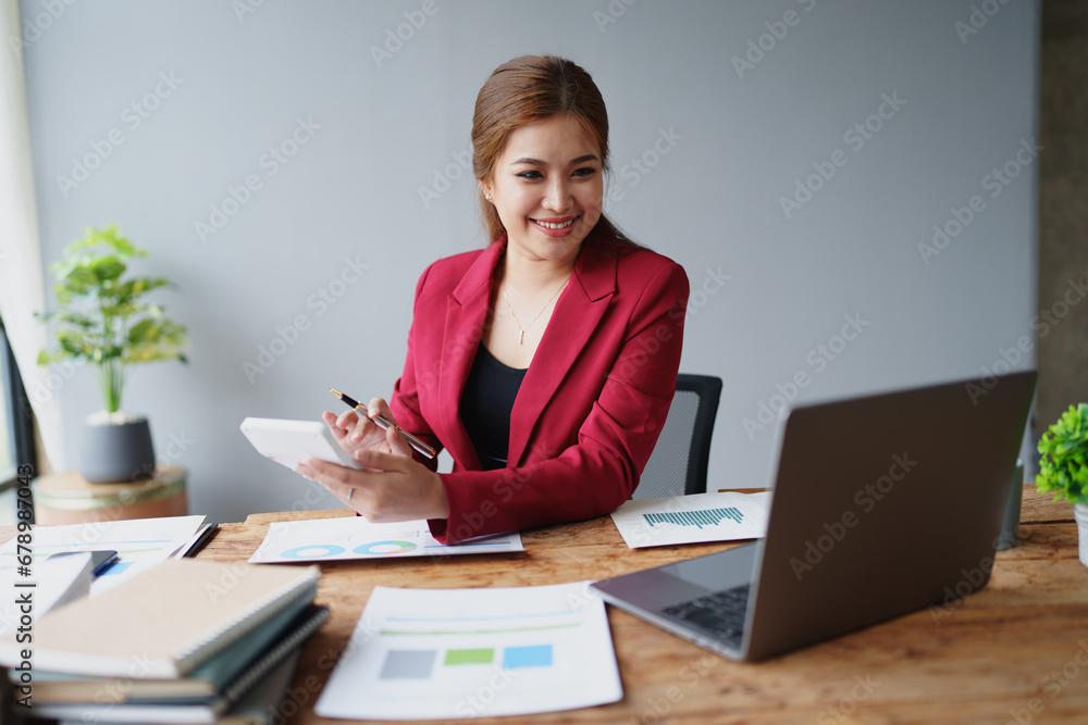 Young asian female work with financial papers at home count on calculator before paying taxes receipts online, planning budget glad to find chance for economy saving money, audit concepts Young asian female work with financial papers at home count on calculator before paying taxes receipts online, planning budget glad to find chance for economy saving money, audit concepts