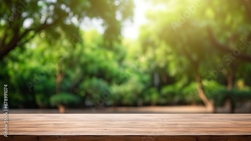 Fotografia Wooden Table Top with Blurred Green Park Garden as Background.