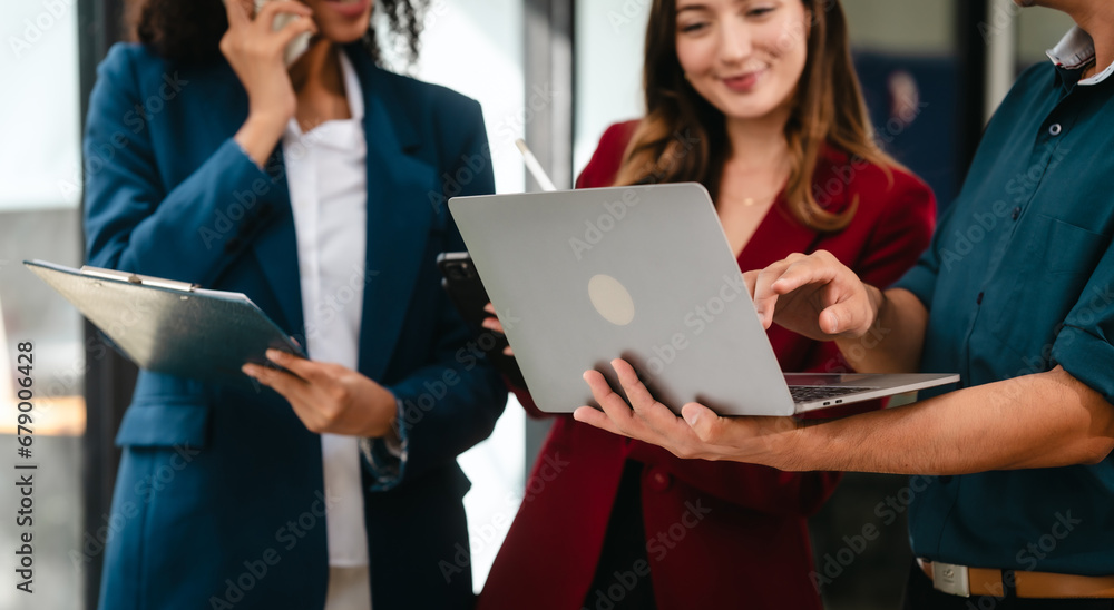 Professional team of caucasian and african american business women and asian man working together, papers, laptop, in office, Invoice, Job order cost system, Investing activities, interest expenses Professional team of caucasian and african american business women and asian man working together, papers, laptop, in office, Invoice, Job order cost system, Investing activities, interest expenses