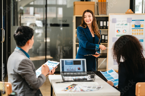 diverse team of professionals engaged in a website graphic design board meeting, sharing opinions on UX and UI design elements. Asian man, African American people, black, afro, caucasian female