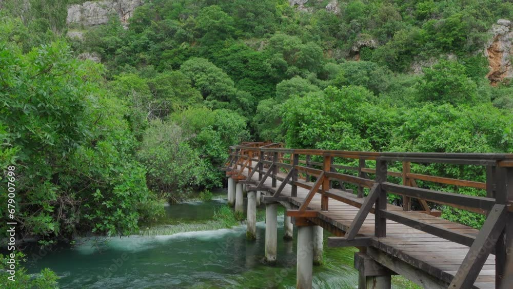 Wooden bridge in the Krka waterfalls (Croatia) Wooden bridge in the Krka waterfalls (Croatia)