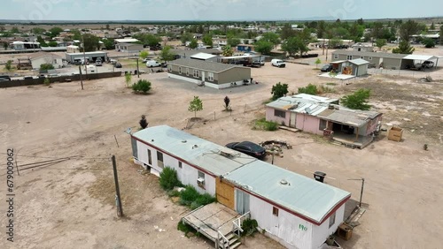 Mobile home in desert area. Aerial shot of trailer park for low income. Southwest USA housing theme.