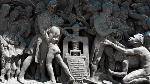 Stone engraved relief depicting Wilberforce and the freedom from slavery