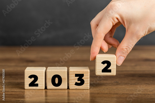 2032 on Wooden Block. Merry Christmas and Happy New Year, 2032 new year idea concept. Going in toward 2032