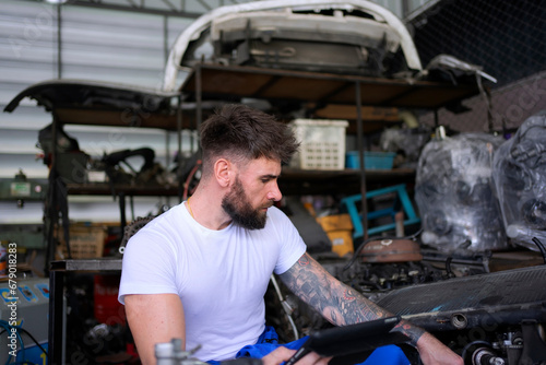 Mechanic work at auto repair shop.