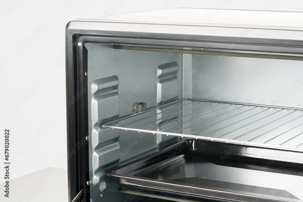 Inside of empty mini electric stove oven Inside of empty mini electric stove oven