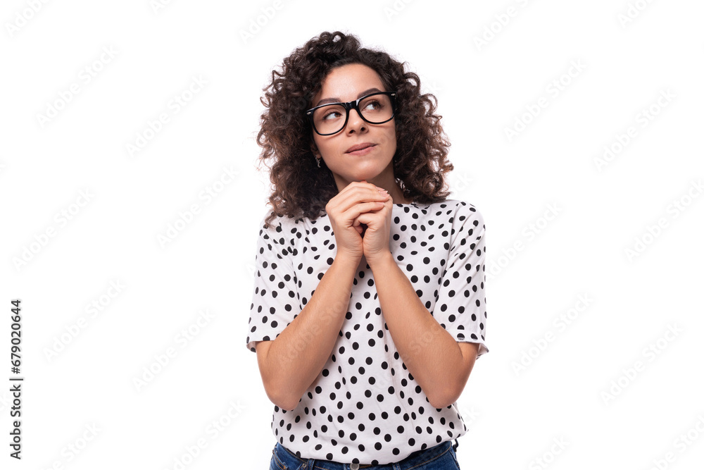 portrait of a young slender caucasian business woman with curly black hair dressed in a summer blouse portrait of a young slender caucasian business woman with curly black hair dressed in a summer blouse