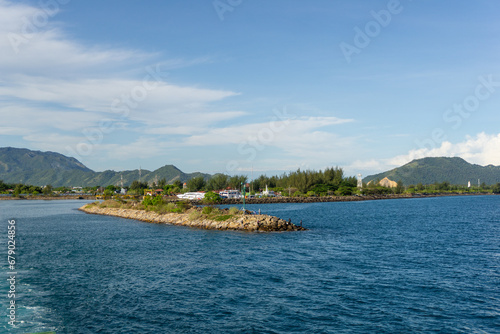 Sea stones breakwater and lighthouse in Ulee Lheue harbor in Banda Aceh, Indonesia. Beautiful ocean view photo