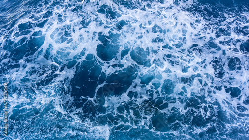 Seascape from high perspective. Top view of ocean sea water splashing.