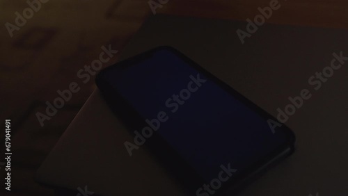 Woman hand using is sliding to turn off the mobile phone to reduce power consumption