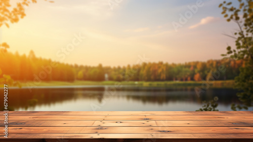 Empty wooden table top with blurred nature background