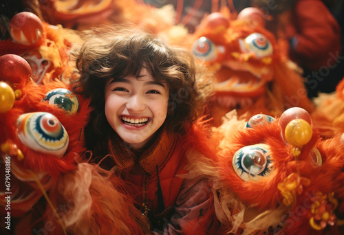 smiling Chinese litter girl with Chinese new year traditional clothing, lunar spring festival