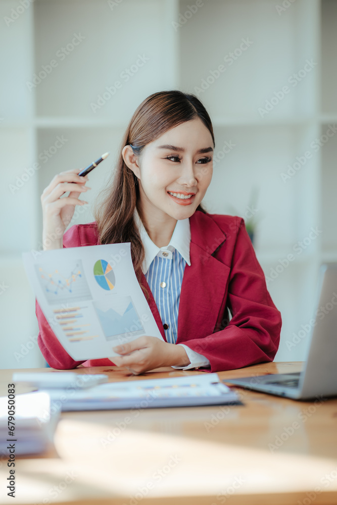 Portrait of a happy beautiful Asian businesswoman.
Working with a tablet in a company office Portrait of a happy beautiful Asian businesswoman.
Working with a tablet in a company office