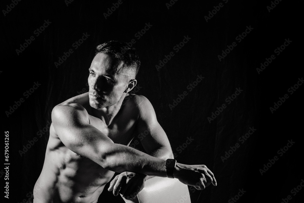Beautiful male torso, muscular bodybuilder posing. Seductive portrait of sport man.