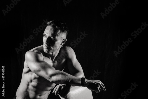 Beautiful male torso, muscular bodybuilder posing. Seductive portrait of sport man.