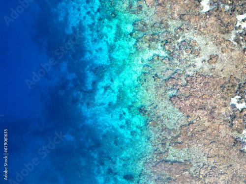 Beautiful tropical blue ocean reef aerial view top down