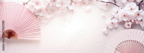 Traditional Japanese fan sensu in pink sakura blossom  spring banner background