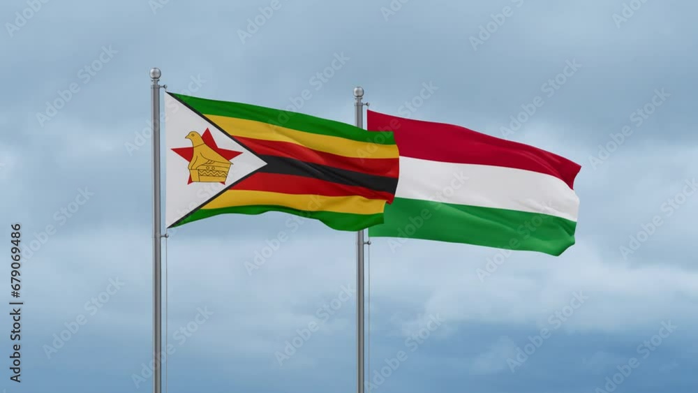Hungary flag and Zimbabwe flag waving together on cloudy sky, endless seamless loop, two country relations concept Hungary flag and Zimbabwe flag waving together on cloudy sky, endless seamless loop, two country relations concept