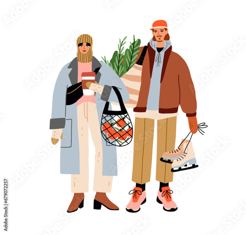 Fashion couple with shopping bags, preparing for winter holidays. Young man a...