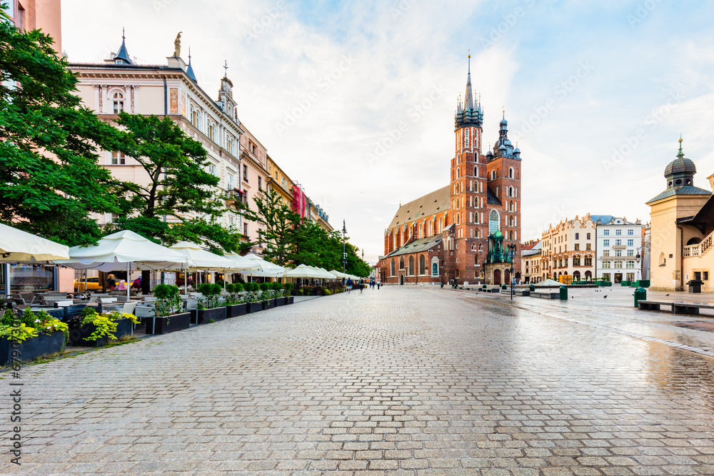 Old town of Cracow, Poland with St. Mary's Basilica and restaurants
