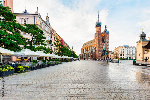 Old town of Cracow, Poland with St. Mary's Basilica and restaurants
