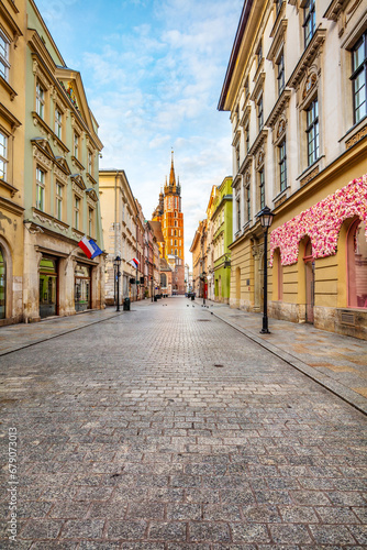Old town street in Cracow, Poland with St. Mary's Basilica © Photocreo Bednarek
